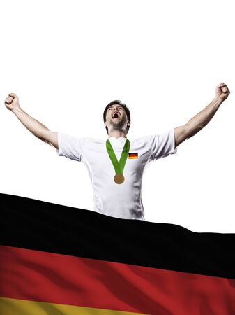German Athlete Winning a golden medal with a German flag in front.の写真素材