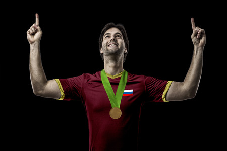Russian Athlete Winning a golden medal on a black Background.の写真素材