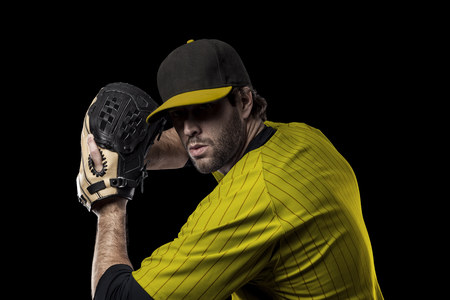 Baseball Player with a yellow uniform on a black background.