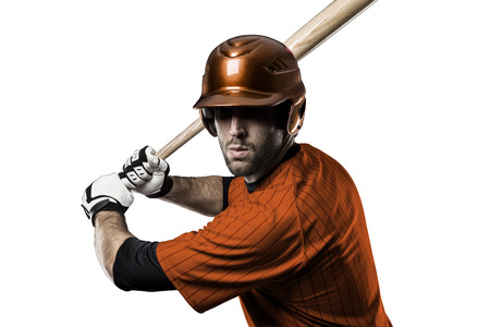 Baseball Player with a orange uniform on a white background.の写真素材
