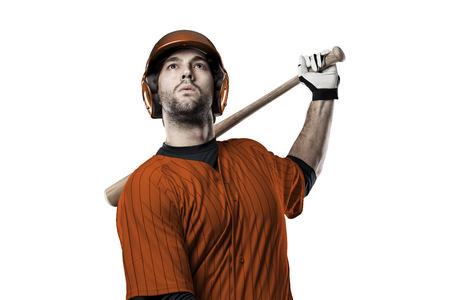 Baseball Player with a orange uniform on a white background.の写真素材
