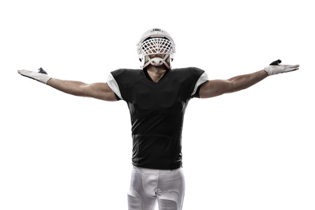 Football Player with a black uniform celebrating, on a white background.の写真素材