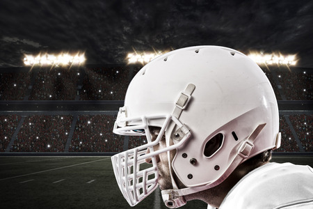 Close up of a Football Player with a white uniform on a stadium.