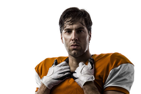 Football Player with a orange uniform on a white background.の写真素材
