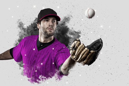 Baseball Player with a pink uniform coming out of a blast of smoke .