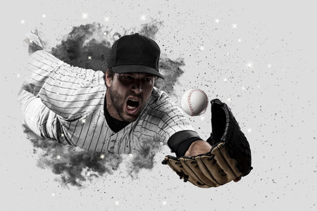 Baseball Player with a white uniform coming out of a blast of smoke .の写真素材