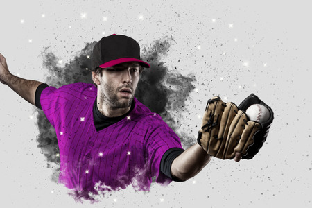 Baseball Player with a pink uniform coming out of a blast of smoke .