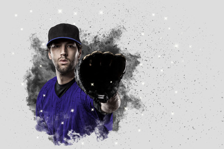 Baseball Player with a blue uniform coming out of a blast of smoke .