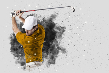 Golf Player with a orange uniform coming out of a blast of smoke .の写真素材