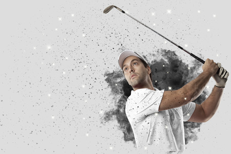Golf Player with a white uniform coming out of a blast of smoke .の写真素材