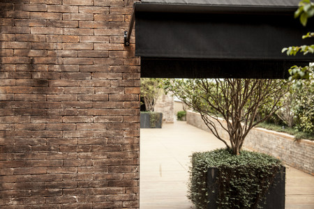 Old brick wall and a glass door.の写真素材
