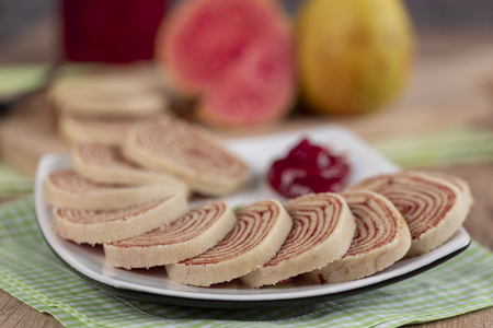 Bolo de rolo (swiss roll, roll cake) typical Brazilian dessert, from the state of Pernambuco. Sliced cake roll filled with Guava paste.の写真素材