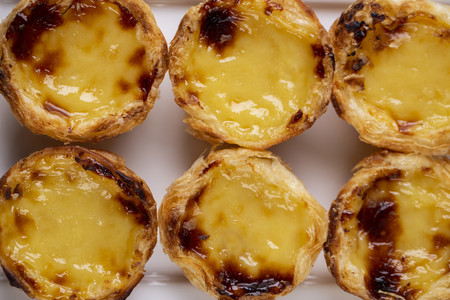 Typical Portuguese custard pies - Pastel de Nata or Pastel de Belem. traditional portuguese pastry.