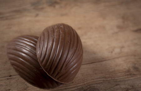 Brazilian Chocolate Easters eggs, on a wooden table.の写真素材