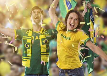 Brazilian couple Celebrating on a stadium on a soccer game, cheering for Brazil to be the champion.