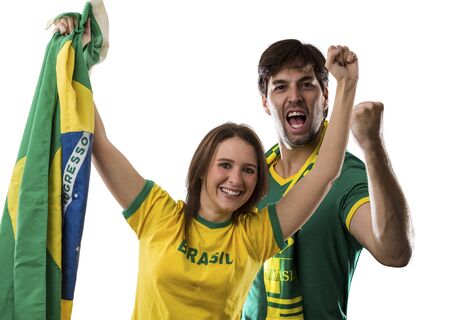 Brazilian couple Celebrating on a white background.の写真素材