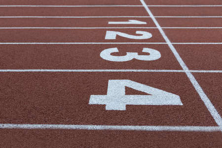 lanes on a running track with the numbers one to four