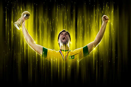 Brazilian soccer player, on a yellow and black background.の写真素材