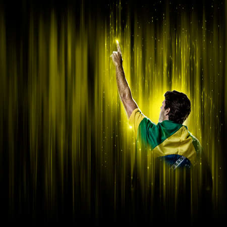 Brazilian soccer player, on a yellow and black background.の写真素材