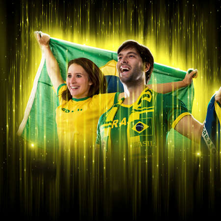Brazilian couple Celebrating the cup on a black background with yellow glow, cheering for Brazil to be the champion.の写真素材