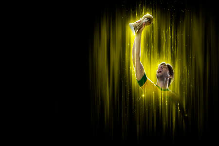 Brazilian soccer player, on a yellow and black background.の写真素材