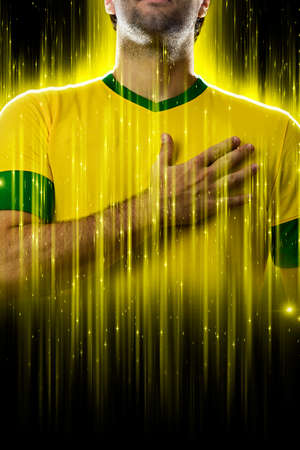Brazilian soccer player, on a yellow and black background.の写真素材