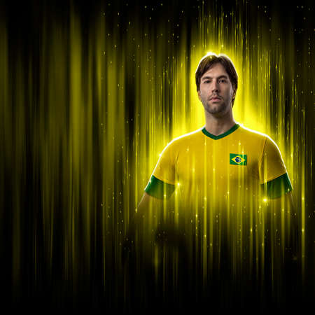 Brazilian soccer player, on a yellow and black background.の写真素材