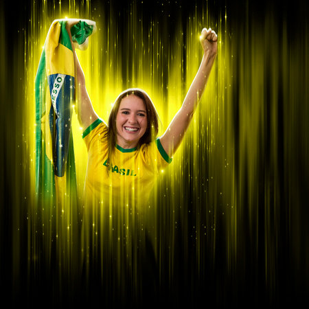Brazilian woman fan, celebrating on a yellow and black backgroun, cheering for Brazil to be the champion.の写真素材