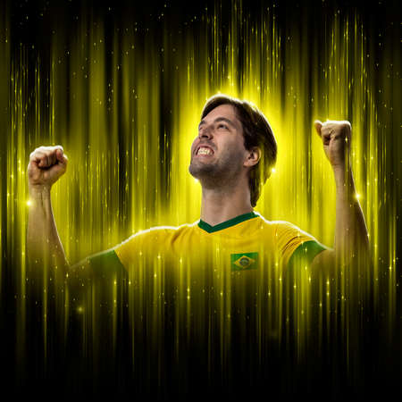 Brazilian soccer player, on a yellow and black background.の写真素材