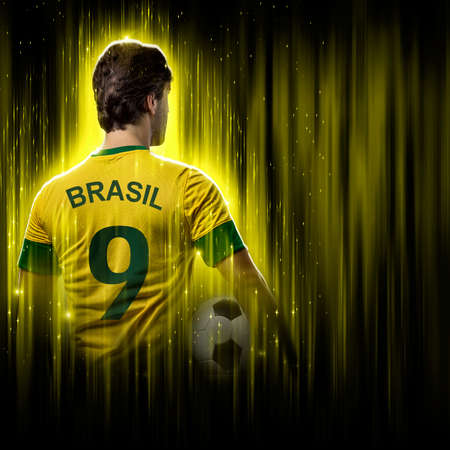 Brazilian soccer player, on a yellow and black background.の写真素材