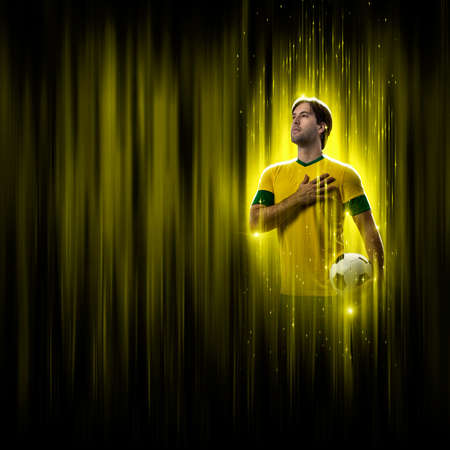 Brazilian soccer player, on a yellow and black background.の写真素材