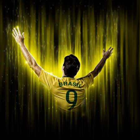 Brazilian soccer player, on a yellow and black background.の写真素材