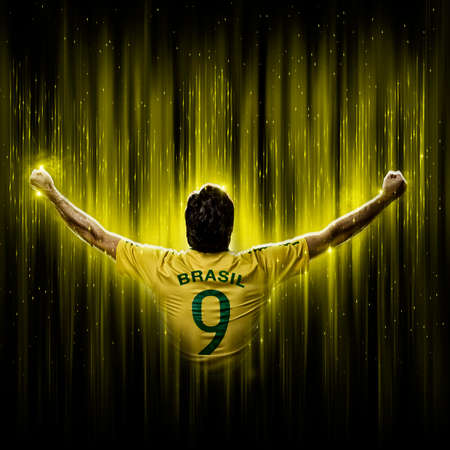 Brazilian soccer player, on a yellow and black background.の写真素材