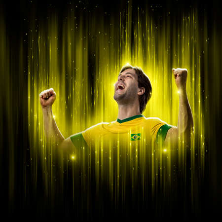 Brazilian soccer player, on a yellow and black background.の写真素材