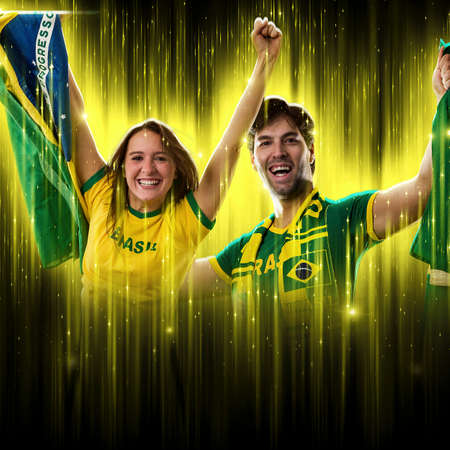 Brazilian couple Celebrating the cup on a black background with yellow glow, cheering for Brazil to be the champion.の写真素材