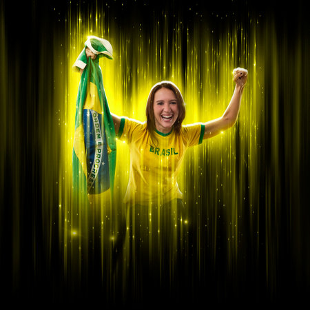 Brazilian woman fan, celebrating on a yellow and black backgroun, cheering for Brazil to be the champion.の写真素材