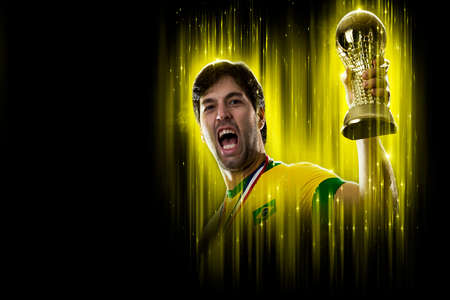 Brazilian soccer player, on a yellow and black background.の写真素材