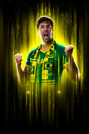Brazilian fan, celebrating on a yellow and black backgroun, cheering for Brazil to be the champion.の写真素材