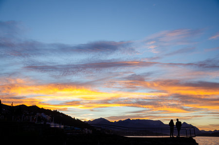 Silhouette of Couple at Sunsetの写真素材