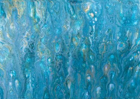 A photograph of an acrylic fluid art painting. Features blue and silver paint to give the effect of water shimmering in the summer sun.の写真素材