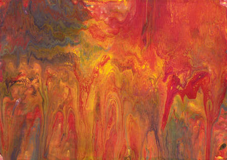 Photograph of fluid acrylic artwork.  The use of red, orange and yellow paint gives the impression of a sunset or fire.の写真素材