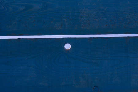 light holes through wooden dark blue planksの写真素材