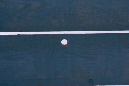 light holes through wooden dark blue planksの写真素材