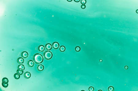 Background air bubble out of blue-colored liquidの写真素材