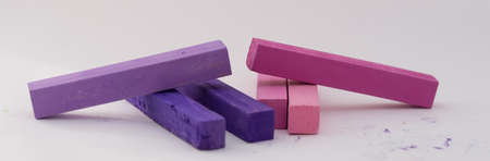 Square colorful pastel chalks tops close up, on white backgroundの写真素材