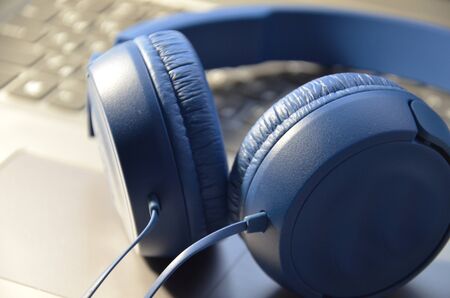 Large headphones, blue color. Close up.