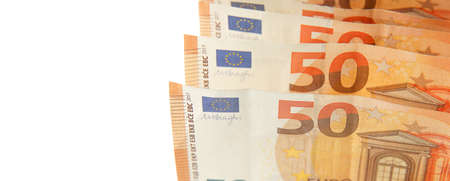 Banknotes 50 euro banknotes close-up with a white background on the left. Paper cash Euro banknotes.の写真素材