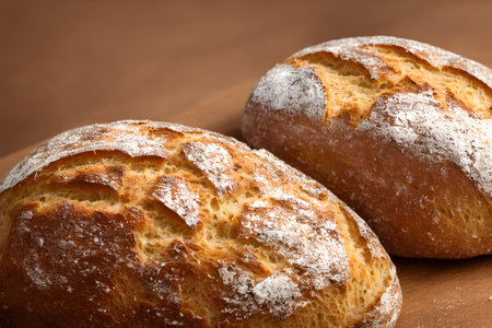 loaf of bread, high calorie staple food, well baked and crusty