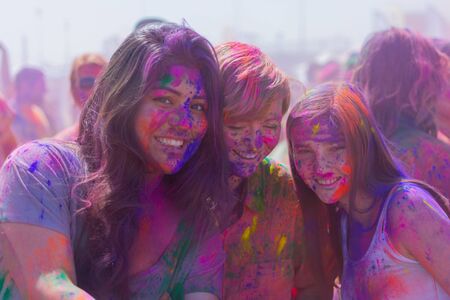 Norwalk, California, USA - March 7, 2015: Unknown women with painted faces during the Holi Festival of Colors.のeditorial素材