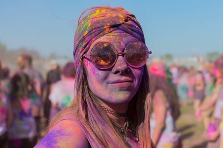 Norwalk, California, USA - March 7, 2015: Unknown woman with painted face and glasses during the Holi Festival of Colors.のeditorial素材